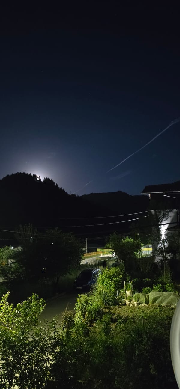 Nighttime rural landscape observed from elevated position in Rudozem
