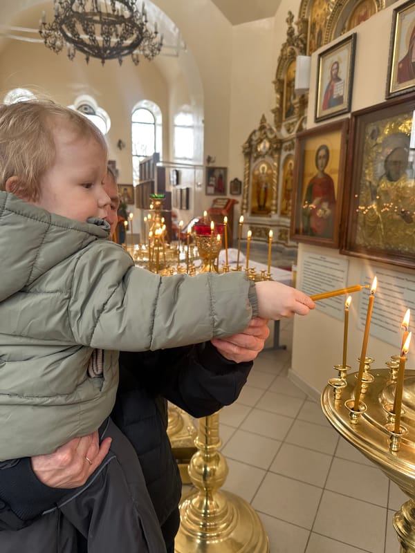 Child participates in Orthodox church rituals in Votkinsk Russia
