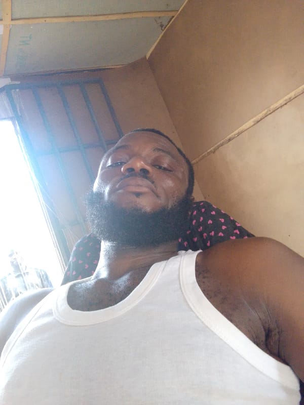 Man takes selfies indoors in Lokoja, Nigeria