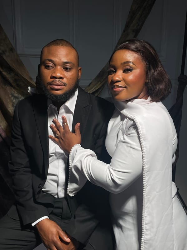 Couple poses for formal portraits in traditional Nigerian attire