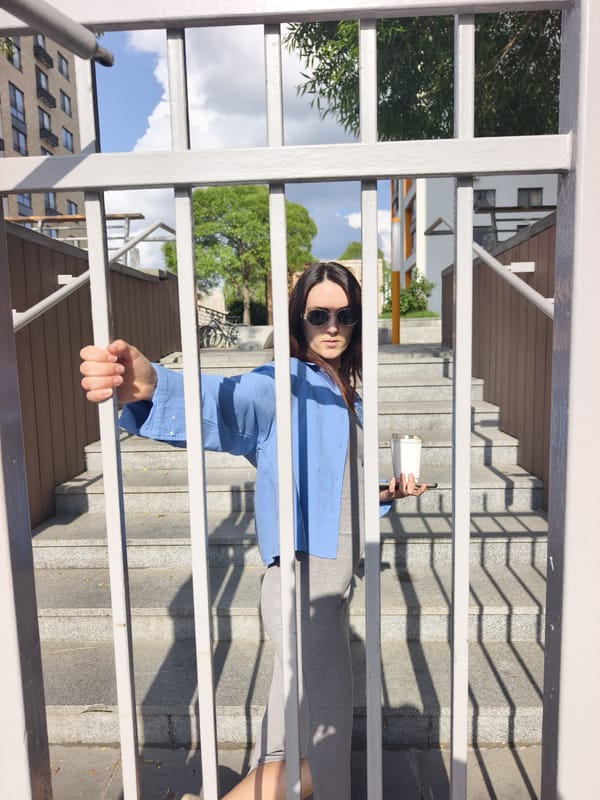 Woman in blue shirt observed walking through Tyumen locations