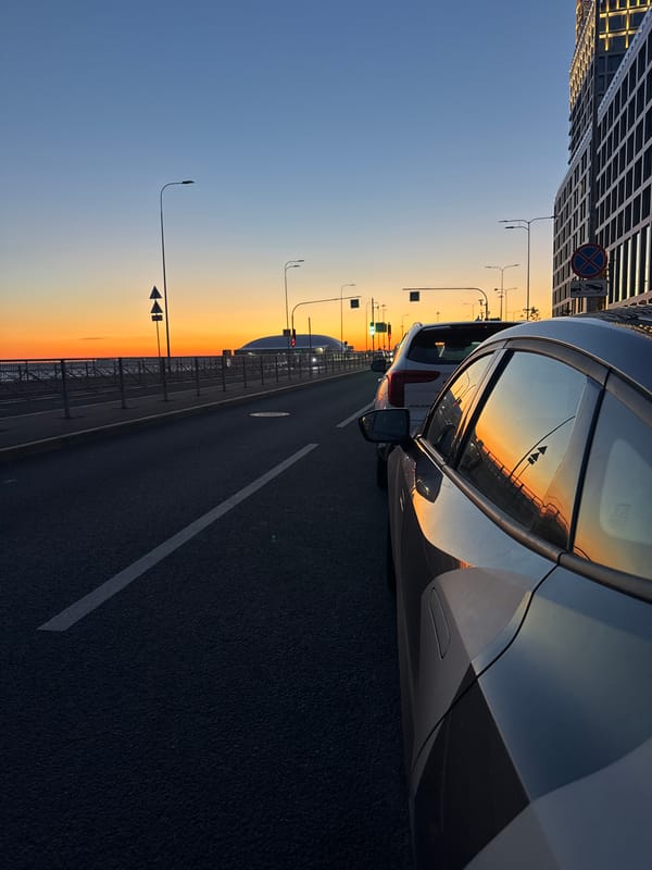 Saint Petersburg street glows under a vivid summer sunset