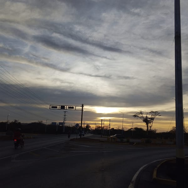 Golden sunset illuminates striated clouds over Santa Ana, Venezuela