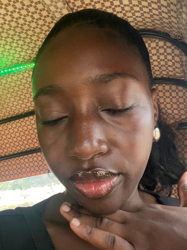 Woman rests on checkered surface in Abuja