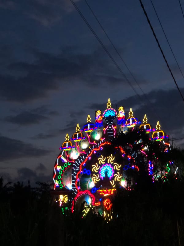 Ornate illuminated festival structure glowing in Habaraduwa, Sri Lanka