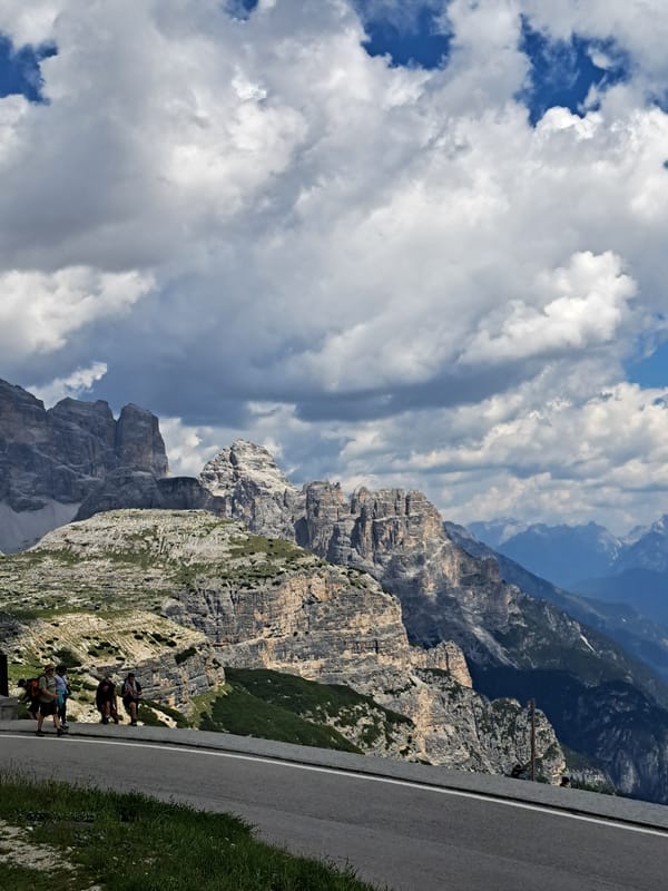 Exploring a rugged mountain landscape from road to ridgeline