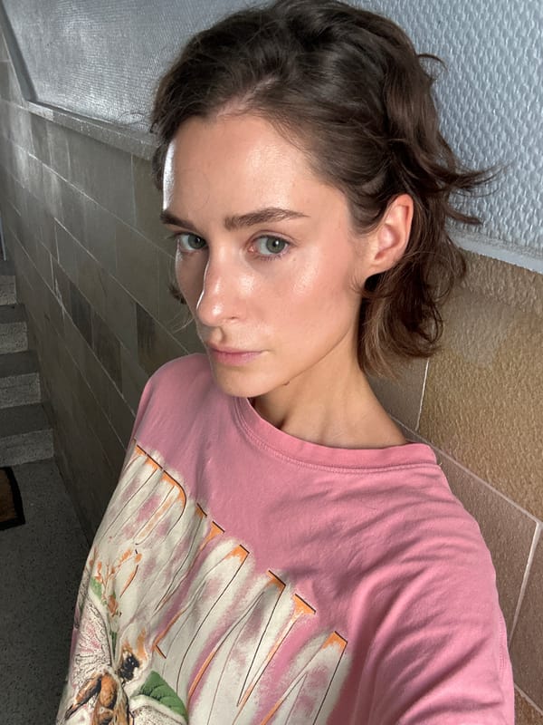 Elevator selfie series in Kiel, pink graphic tee throughout