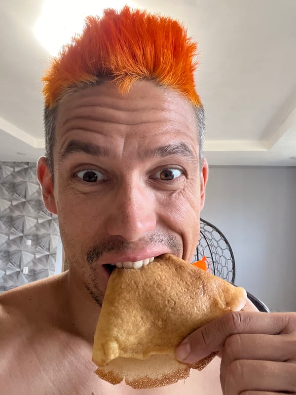 Person enjoys pastry and coffee in Chaikovsky, Russia