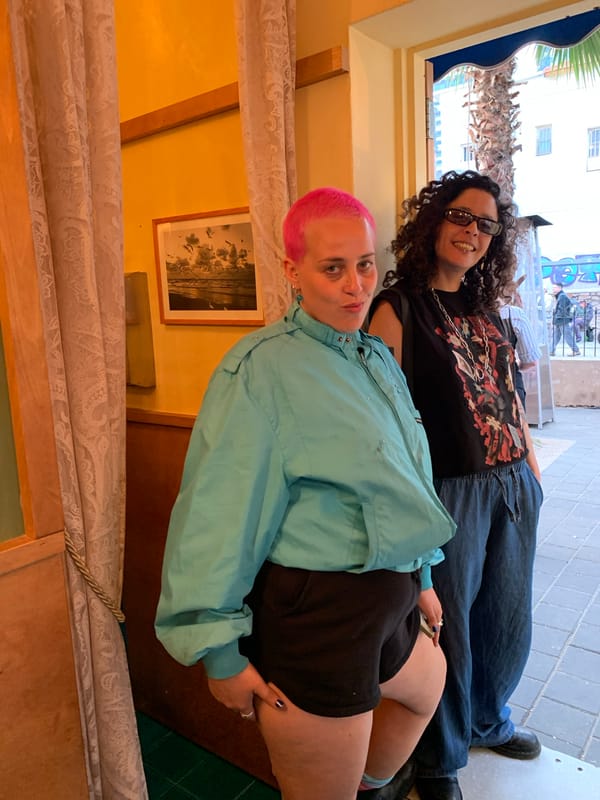 Young diners enjoy outdoor meal in sunny Tel Aviv