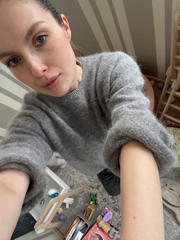 Woman documents playtime moments with toddler and cat in Moscow home
