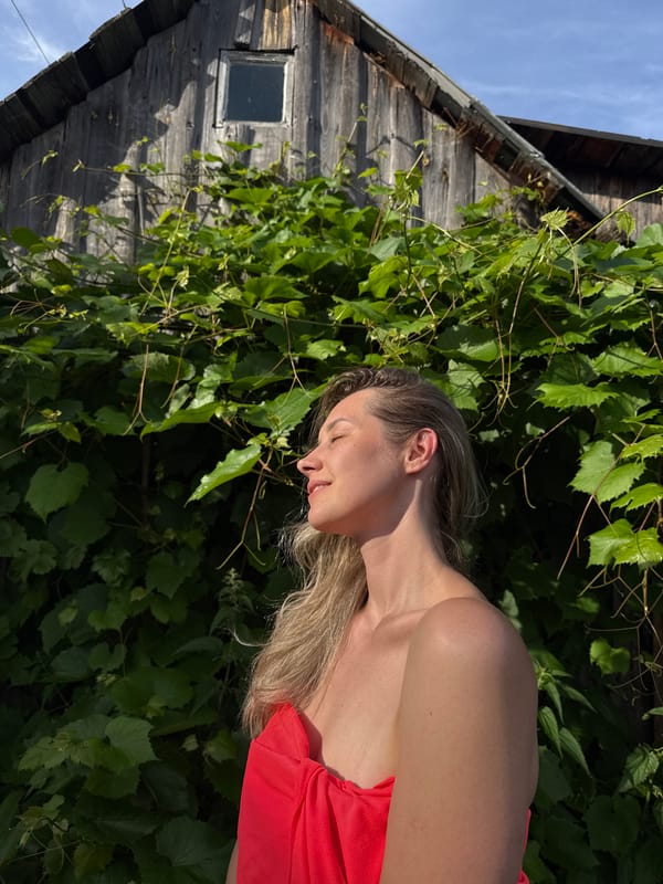 Casual outdoor portraits near a wooden building in Chaikovsky