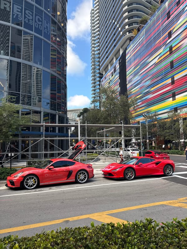 Evening scenes of red Porsche and bakery in downtown Miami