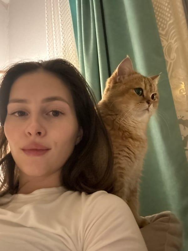 Woman photographed with cat in indoor portraits, Yekaterinburg
