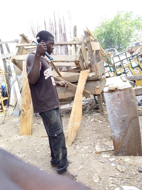Traditional craftsmen work in outdoor workshops in Jimeta, Nigeria