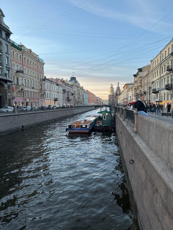 Evening street life documented across central Saint Petersburg landmarks