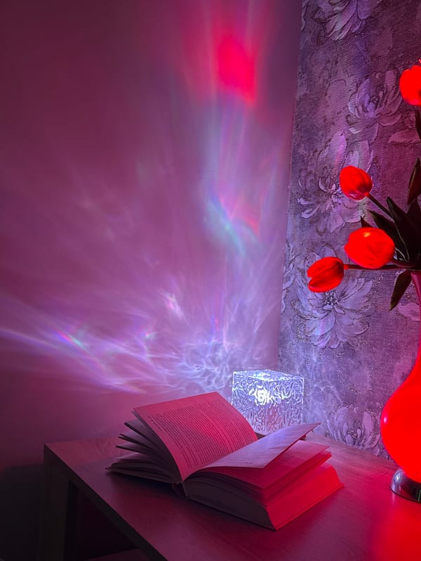 Evening reading session with Russian books under colored lighting