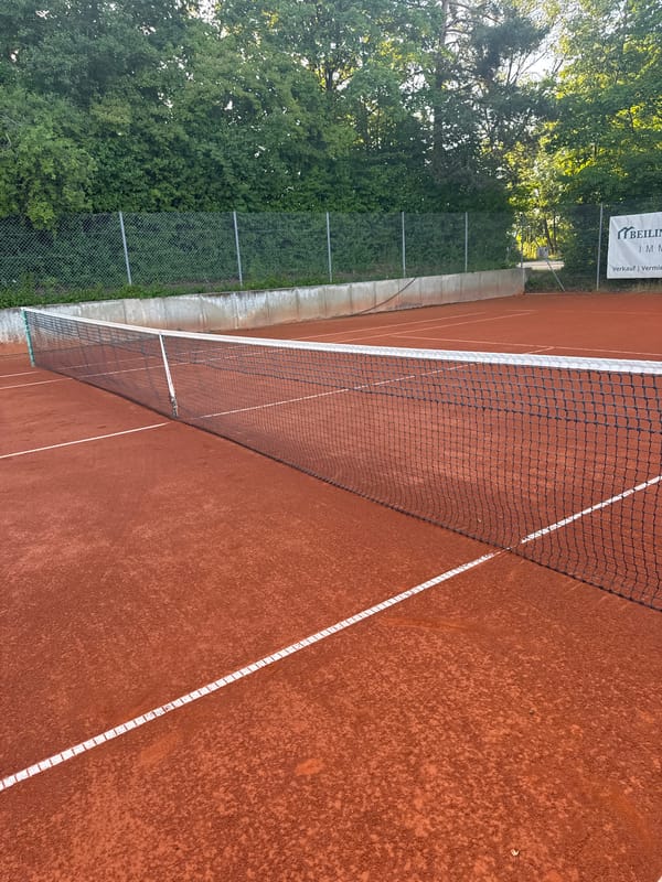 Afternoon tennis session at a clay court in Neubiberg