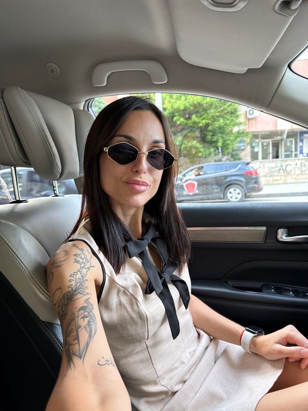Woman takes rotated selfie in car in Pleven, Bulgaria