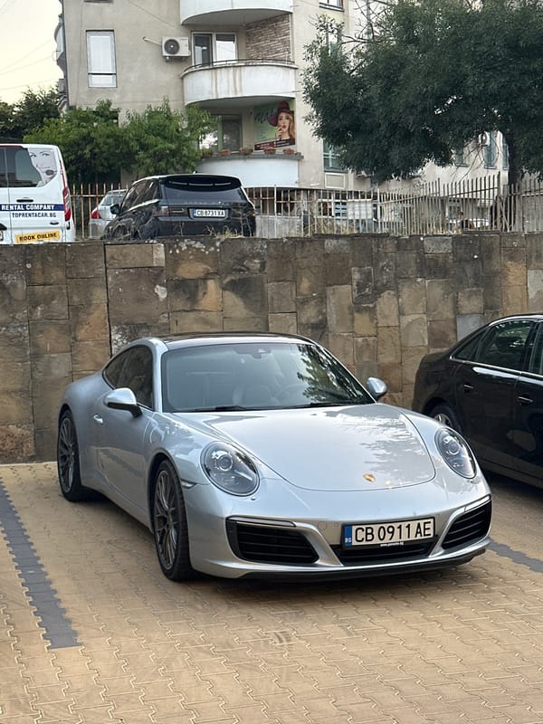 Exotic cars parked in Veliko Tarnovo on a grey afternoon