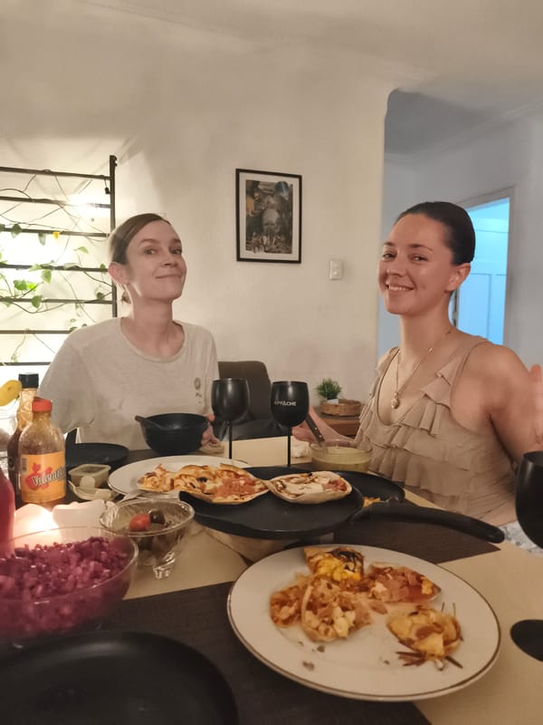 Women share late-night pizza dinner at Mexico City home
