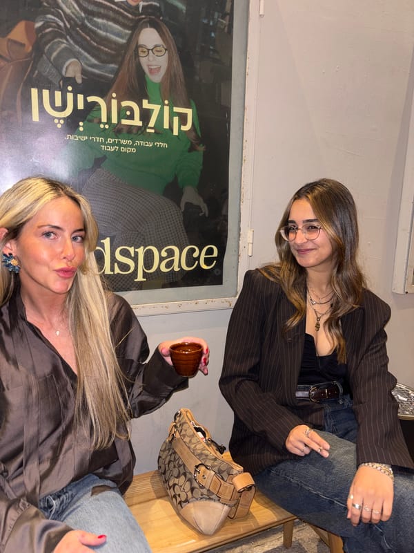 Two women sit together in Tel Aviv