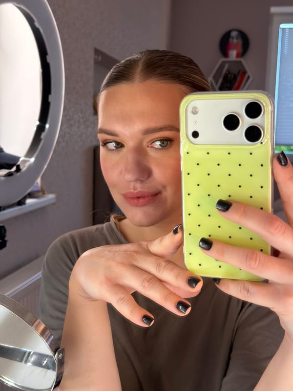 Person takes selfie with green iPhone in Dreiliņi, Latvia