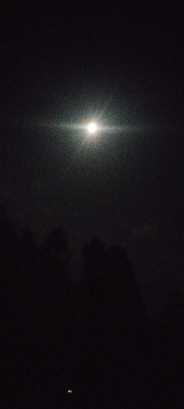 Bright full moon observed over Karateri, Uzbekistan evening sky