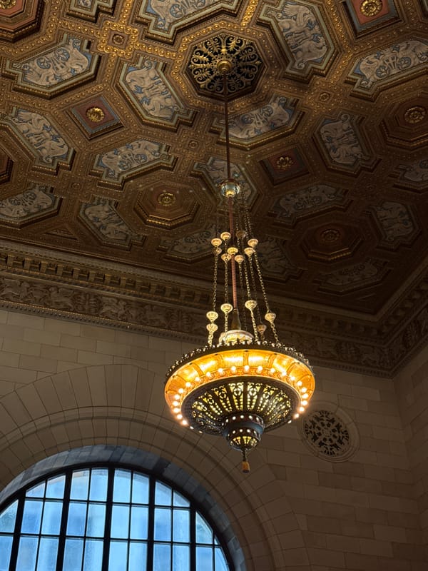 Tourists document historic Windsor Station architecture in Montreal