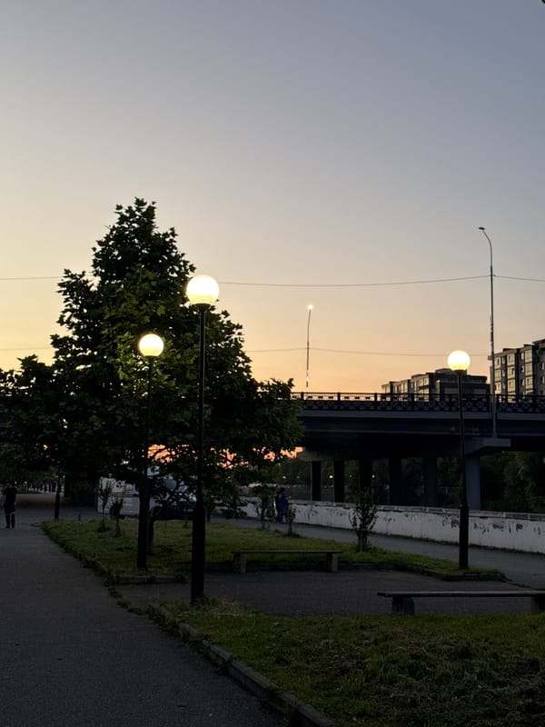 Dusk settles over a quiet street in Kamysh-Gadzhiaul, Russia