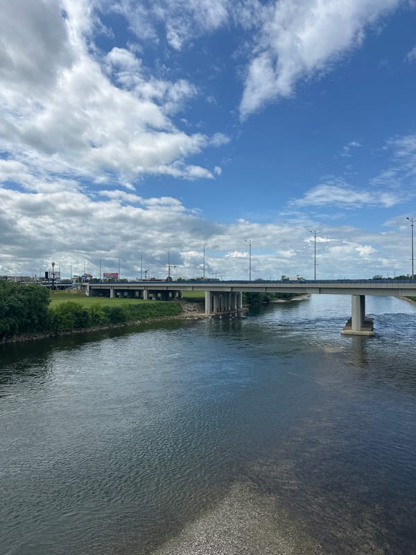 Bridge and clouds reflected in Zagreb river scene