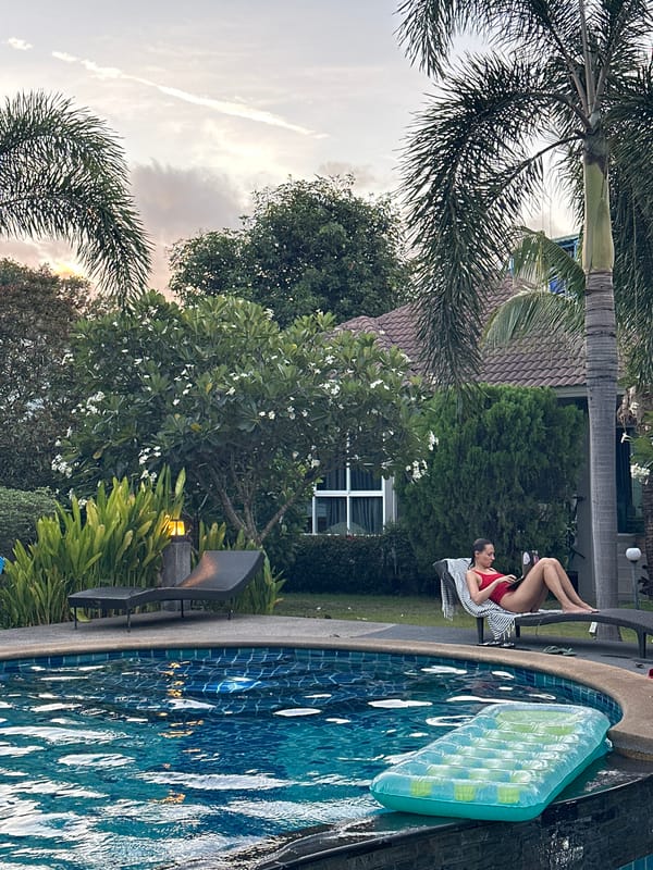 Poolside afternoon and tropical flora in Baan Mae Nam