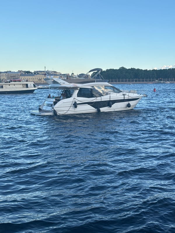 Sunny afternoon along the Neva with the Aurora cruiser