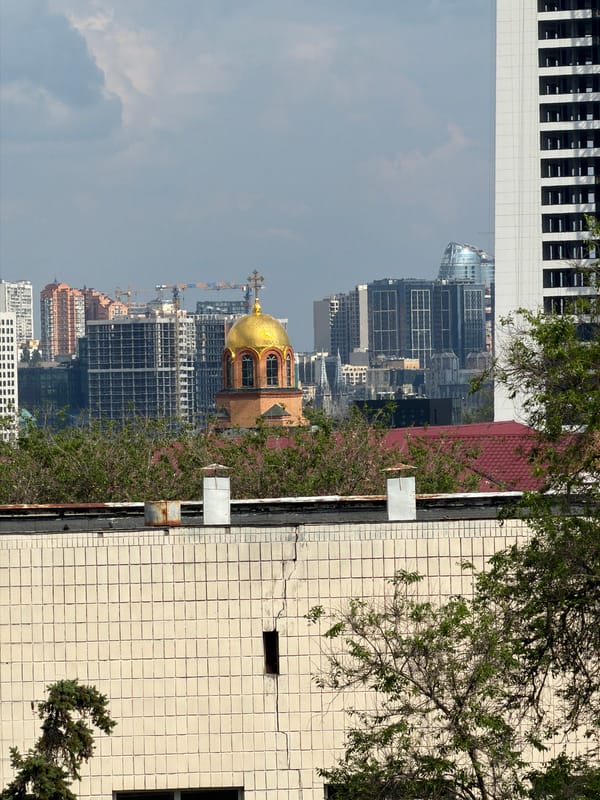 Musician documents instruments and cityscape during afternoon in Kyiv