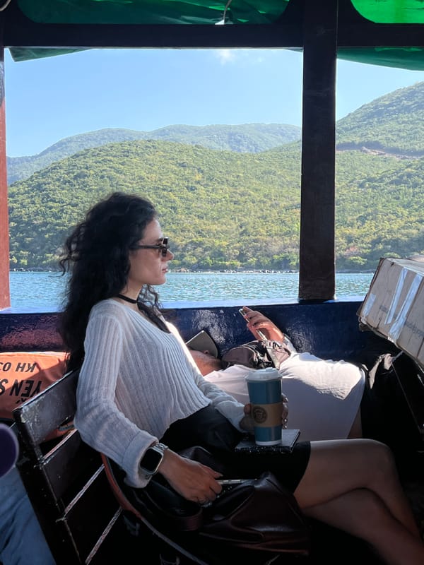 Woman relaxes on boat in Nha Trang waters