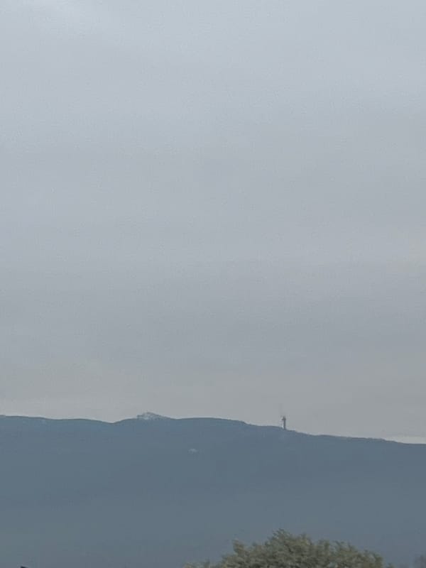 Mountain range observed under heavy cloud cover