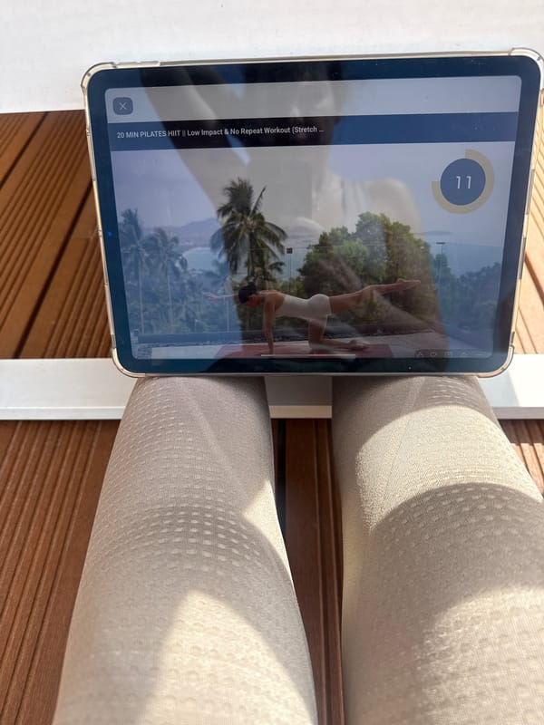 Person uses iPad on wooden deck in Vila Nova de Gaia