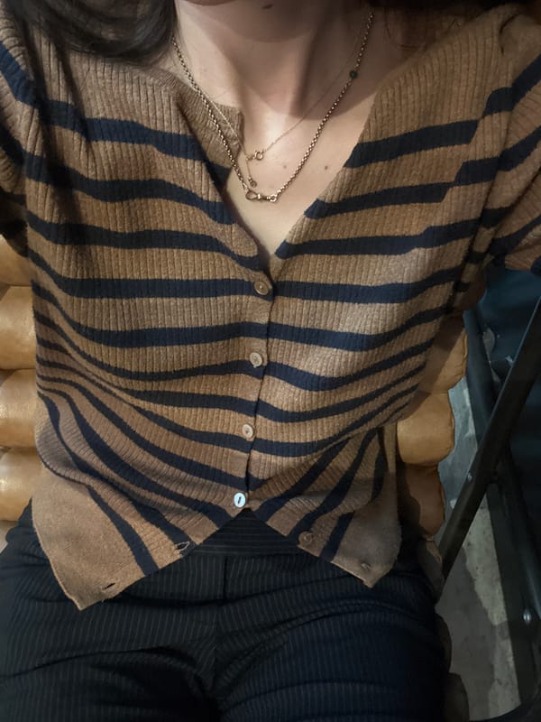 Person in striped cardigan observed in New York