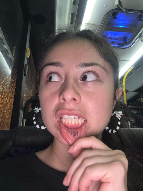 Woman smiles during rainy bus ride in Attadale