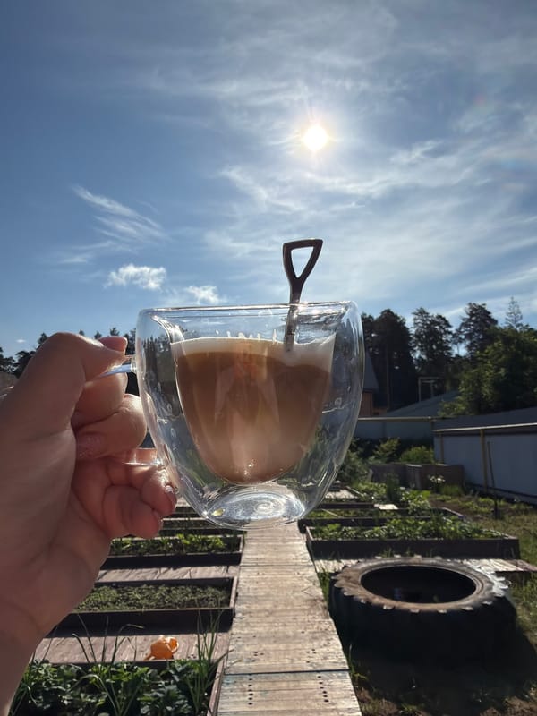 Woman enjoys morning coffee in greenhouse, Chaikovsky Russia