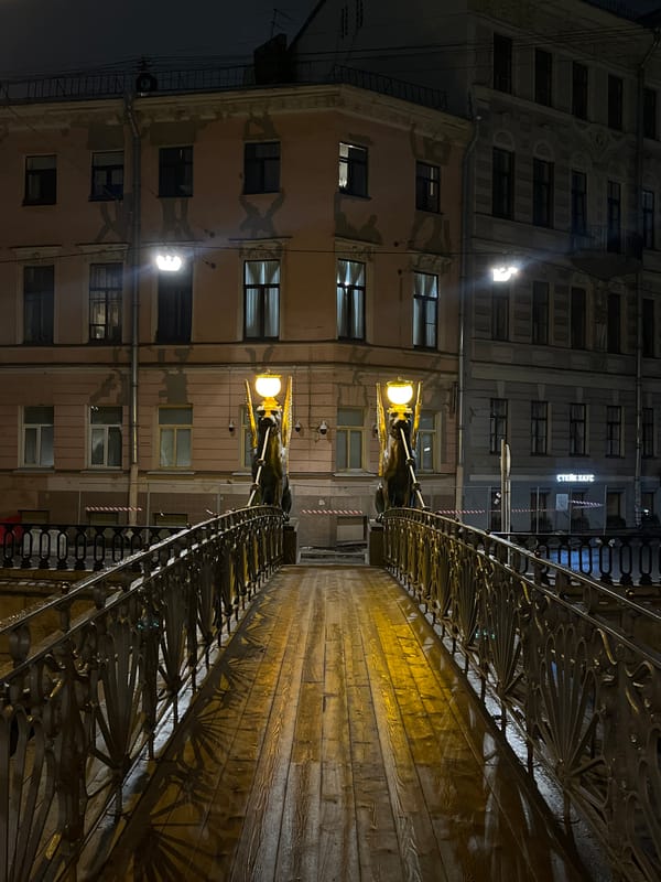 Evening documentation of ornate bridge features in Saint Petersburg