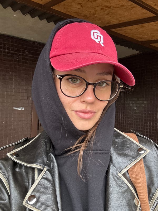 Woman takes selfie in red cap in Krasnoyarsk