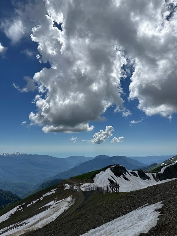 Mountain landscapes around Estosadok under shifting skies