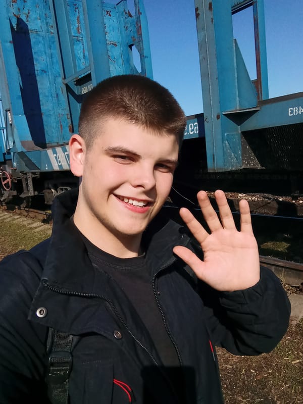 Tourist takes selfies at Russian railway yard in Andreyevo