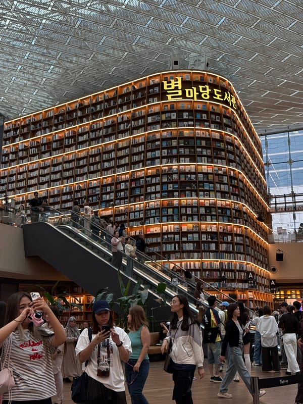 Morning visitors explore Seoul's illuminated Starfield Library attraction