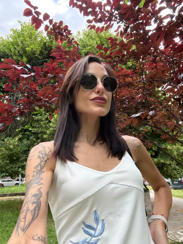Woman takes selfies in park area in Pleven, Bulgaria