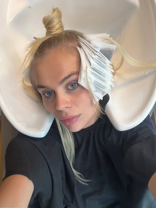Hair highlights and selfies at a Dubai salon with skyline views
