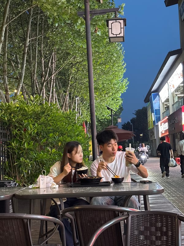 Woman poses for photos outside Jiangjin commercial district