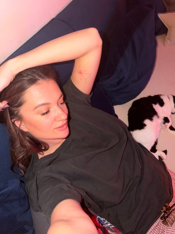 Woman and cat share quiet moment in Belgrade apartment