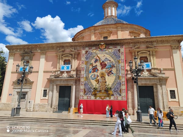 Street musician performs near Valencia Cathedral, draws donations