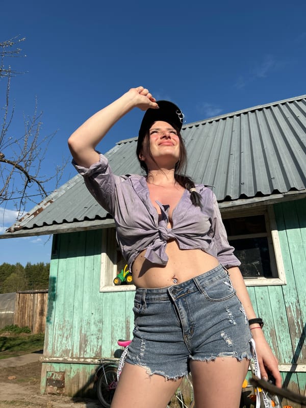 Woman poses for outdoor photo session in Rusalevka, Russia
